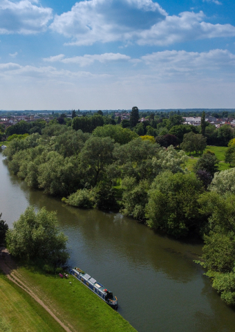 Thames river running through green fields in Abingdon